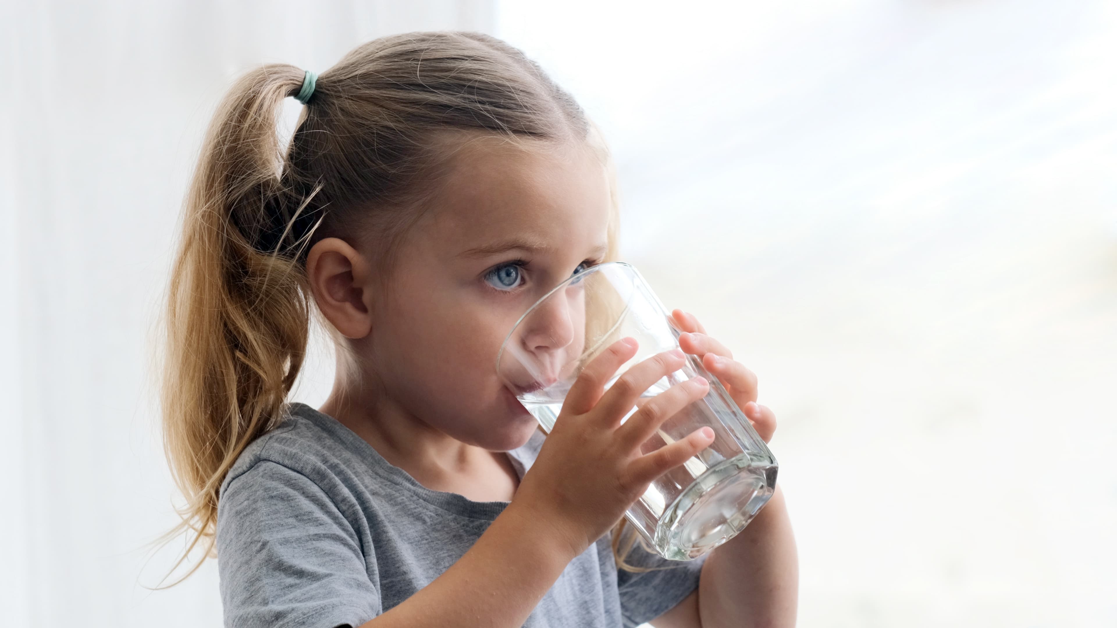 Child drinking clean, filtered water